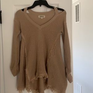 Distressed beige sweater